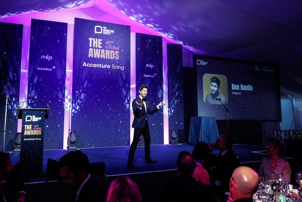 Ben Hanlin – awards host in the UK engaging a corporate audience on stage.