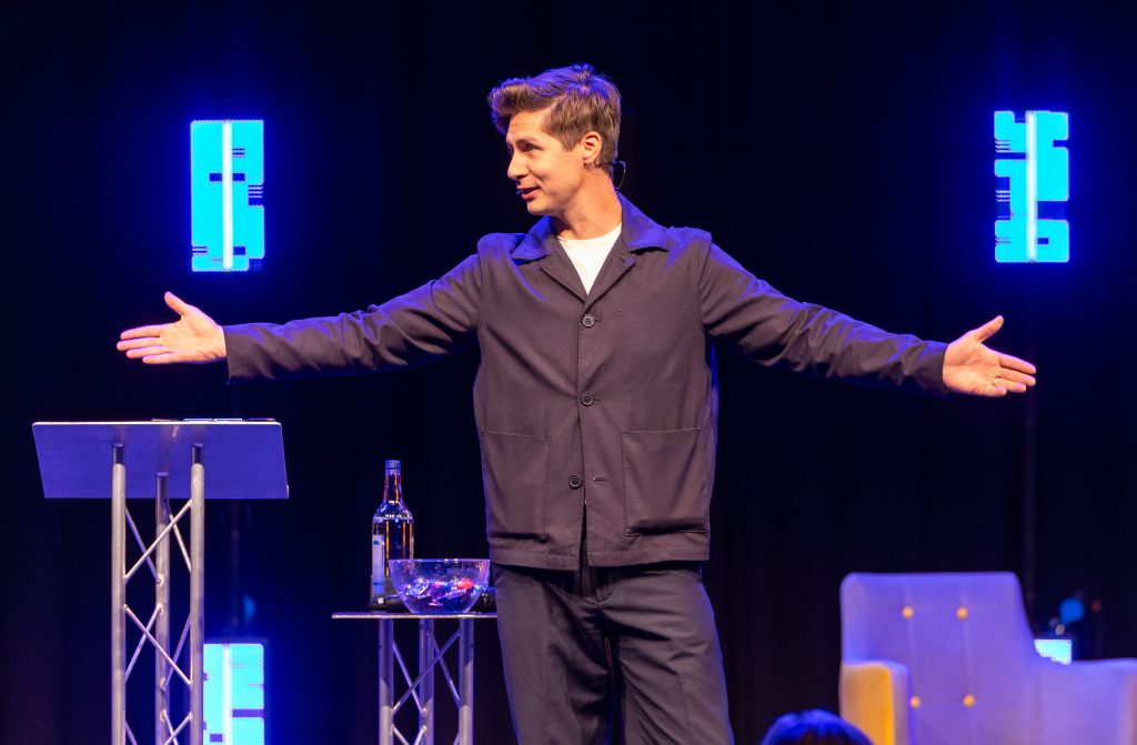 Ben Hanlin demonstrating how to open a presentation with confidence by walking the stage.