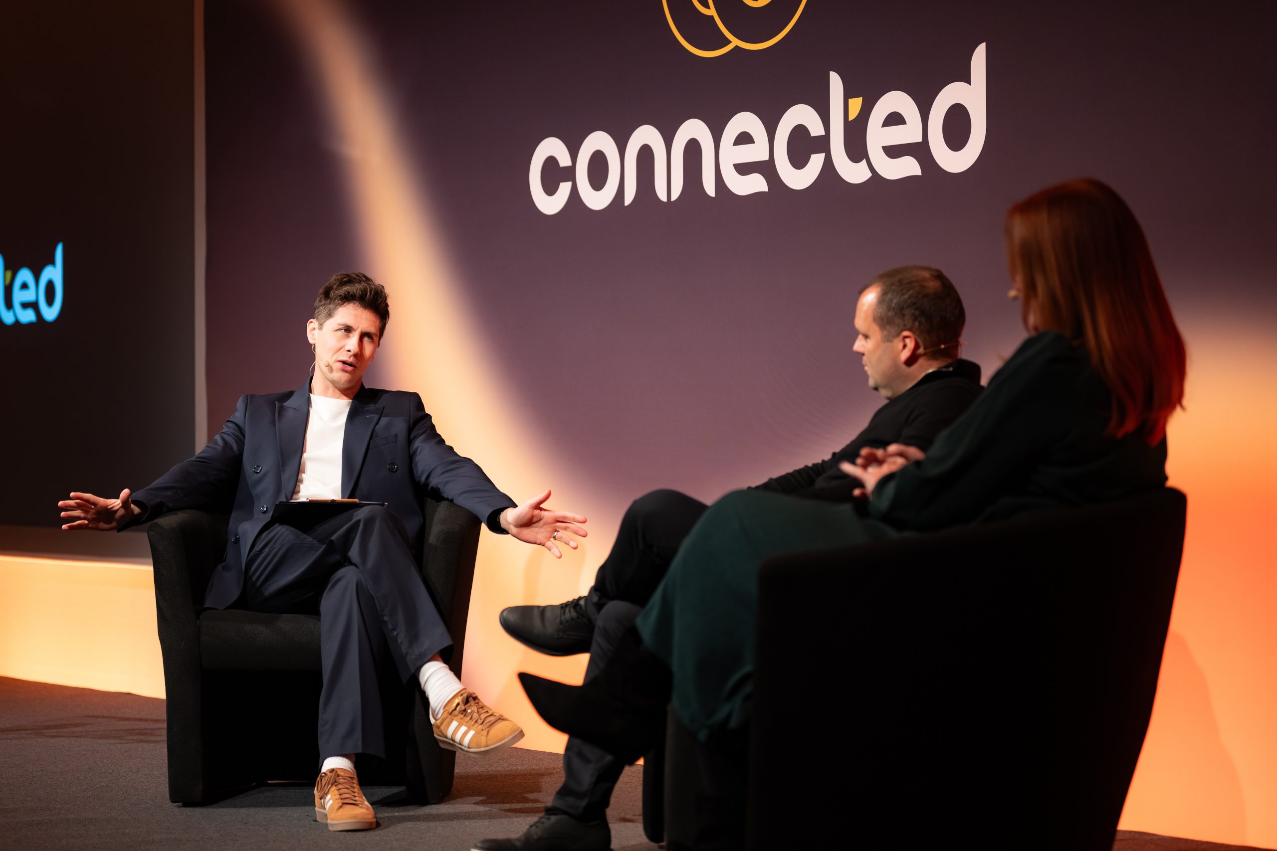 Ben Hanlin listening attentively during a presentation, demonstrating strong business communication skills.