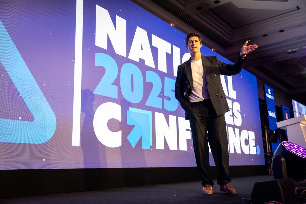 Ben Hanlin delivering a keynote about mindset and business communication skills to a corporate audience.