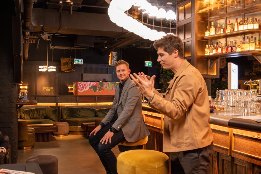 Ben Hanlin speaking on stage, demonstrating storytelling in business by sharing a personal, human-focused story.